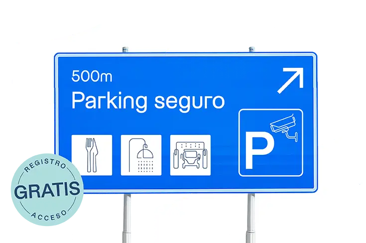 Señal de carretera azul que indica un parking seguro a 500 metros, con iconos de servicios como restaurante, duchas, área de descanso y videovigilancia. Registro y acceso gratis al parking seguro Vrio–SNAP.